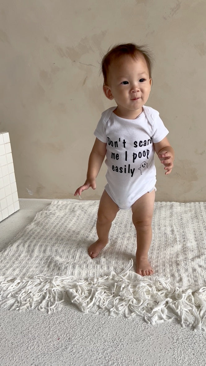 Don’t Scare Me I Poop Easily Baby Onesie®